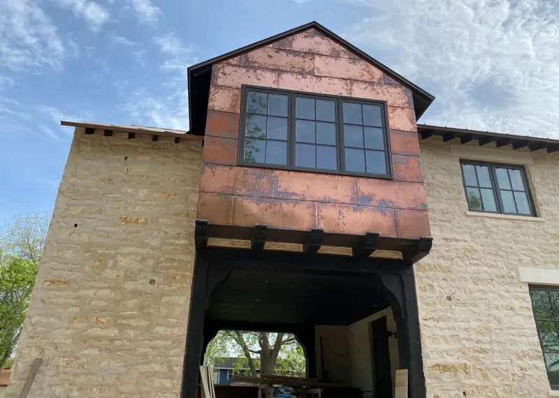 Copper metal panel facade on a stone building for Skylight Installation in Middle Paxton